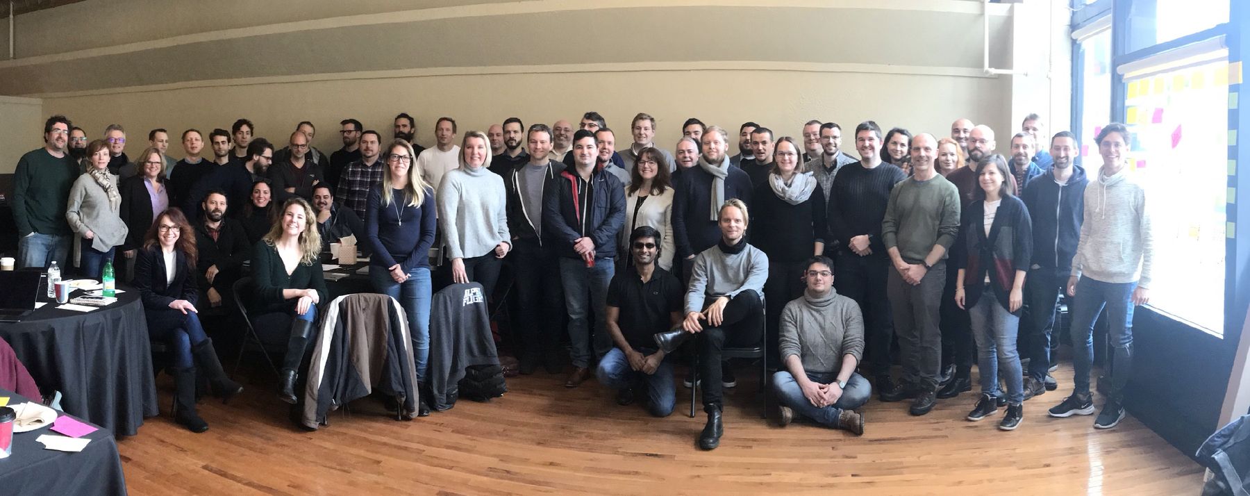 Erica Jenkins with a large team gathered for a group photo at an annual planning offsite